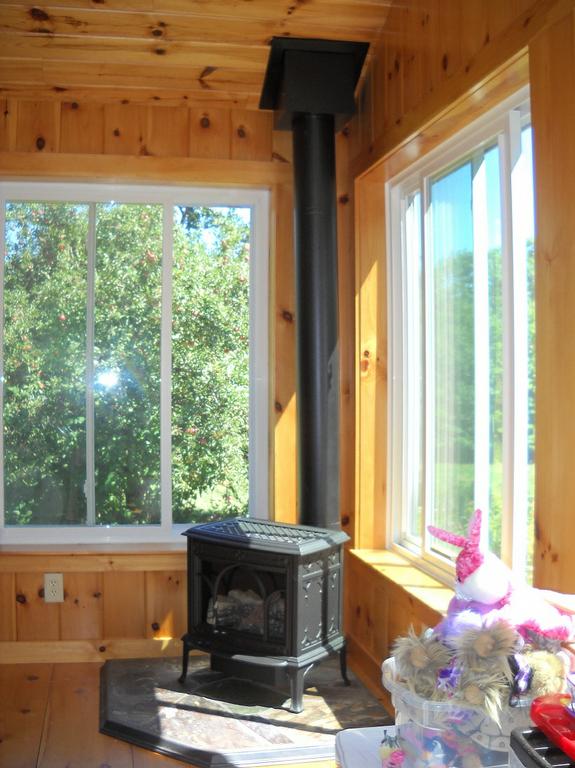 Jotul Allagash Gas Stove in New Hampshire Sunroom from Fireplace